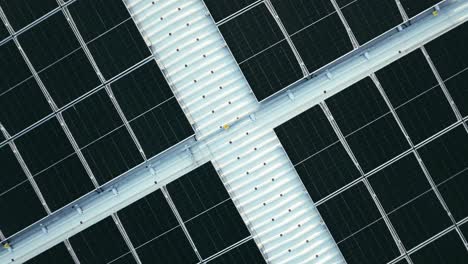 an aerial view capturing a solar panel installation on a rooftop.top-down perspective.