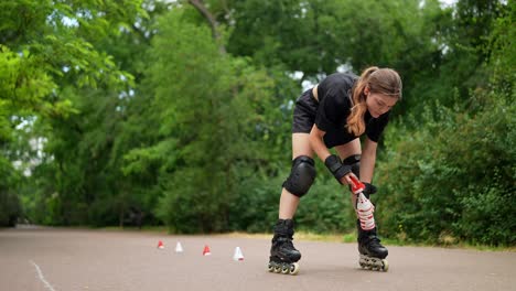 woman rollerblading in park