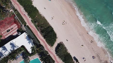 Popular-Miami-beach-aerial-view-with-beautiful-green-water-in-the-ocean