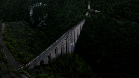 aerial view of ponte delle torri - arched bridge in spoleto, italy - drone shot