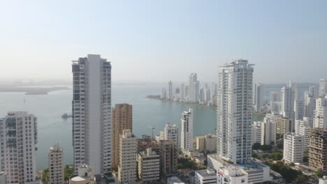 Aerial-Pullback-Reveals-Skyscrapers-in-Cartagena,-Colombia