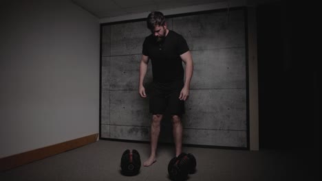 dumbbell bent over row, cinematic lighting, white man dressed in black gym attire