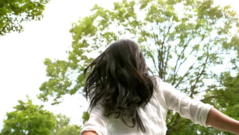 carefree brunette in the park