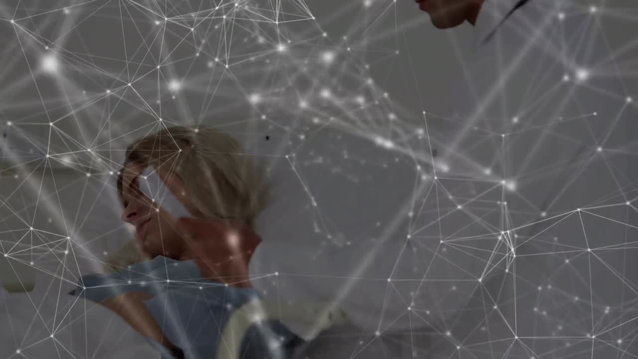Animation of network of connections over caucasian male doctor and patient