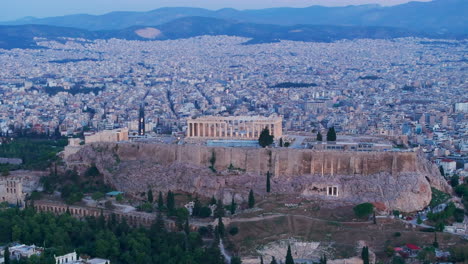 tight circling aerial shot of the acropolis at dawn