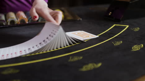 croupier shuffling poker cards.