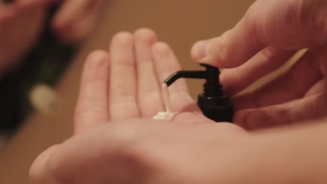 hand cream is squeezed out of a pump