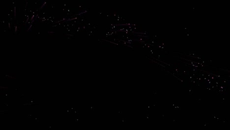 una luz de color rosa suave brillante está fluyendo o volando al azar sobre un fondo negro