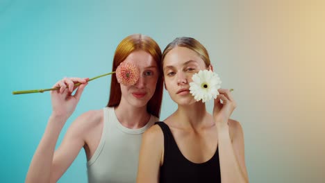 two women with flowers