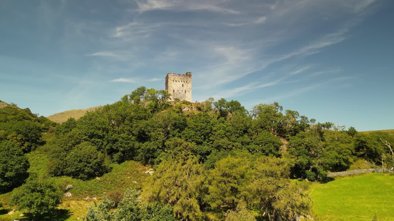 Dramatic Dolwyddelan Castle on a lovely summer afternoon - aerial drone rise up and reveal - North Wales, UK