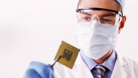 technician repairing motherboard chip