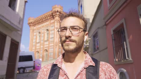 Handsome-young-man-walking-on-the-street.