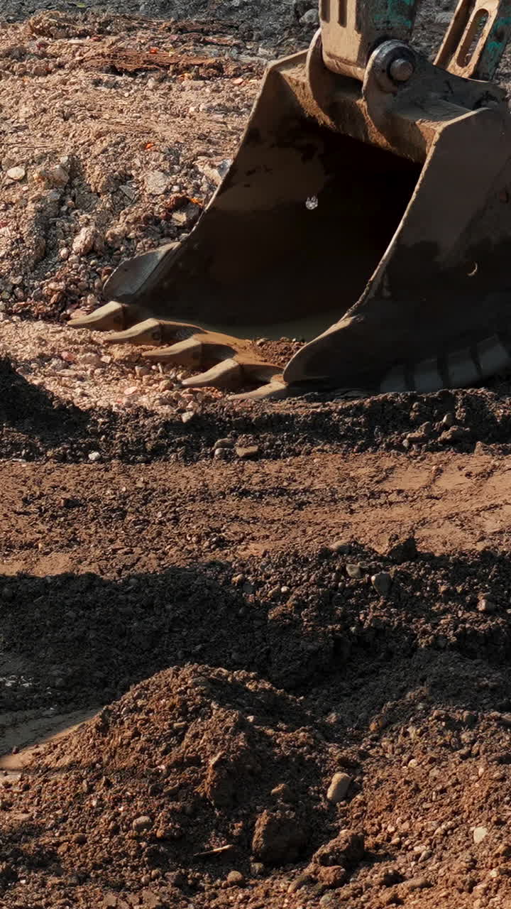 Excavator digging and moving soil