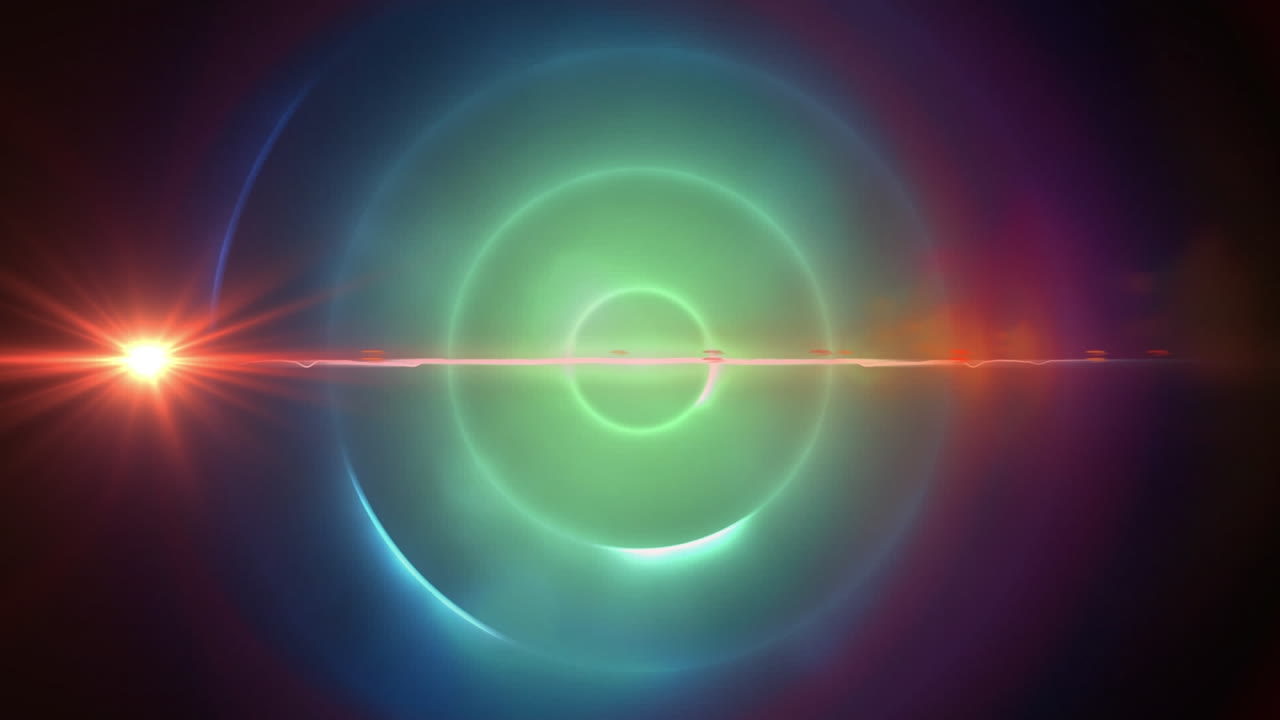 Red spot of light and light trails against green spiral light trails on blue background