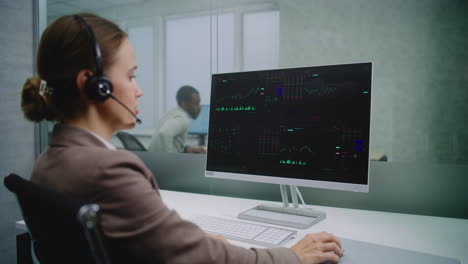 Businesswoman monitoring stock market data
