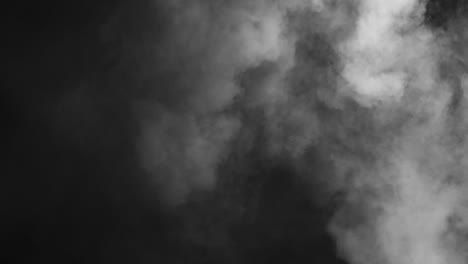 Abstract-white-smoke-in-slow-motion.-Smoke,-Cloud-of-cold-fog-in-light-spot-background.-Light,-white,-fog,-cloud,-black-background,-4k,-ice-smoke-cloud.-Floating-fog.