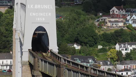 The-Royal-Albert-Bridge-Over-the-River-Tamar-built-by-Isambard-Kingdom-Brunel-with-a-Cross-Country-Train-Crossing-Over-the-Bridge-on-a-Summer's-Day-in-England