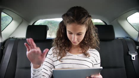 Keeping herself entertained on a roadtrip