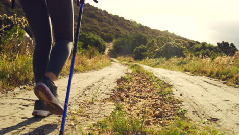 Two-hikers-hiking-up-a-trail-on-a-mountain