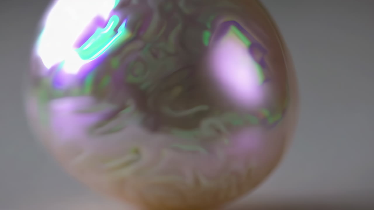 Close-up of an iridescent pearl or ornament