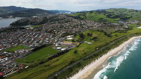 Aerial-view-of-Dunedin-coastal-city-from-above-at-a-sunny-day
