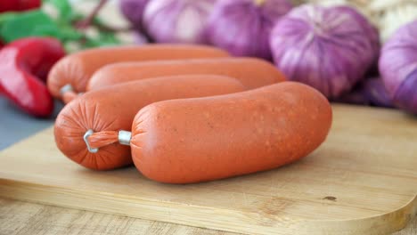 raw sausages and vegetables