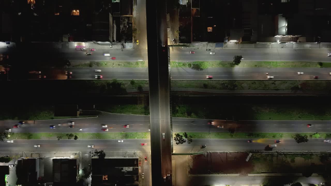 Night aerial hyperlapse on an avenue with car movement and lights