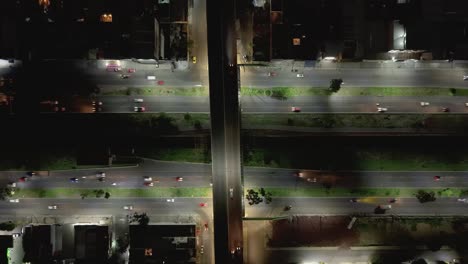 night aerial hyperlapse on an avenue with car movement and lights