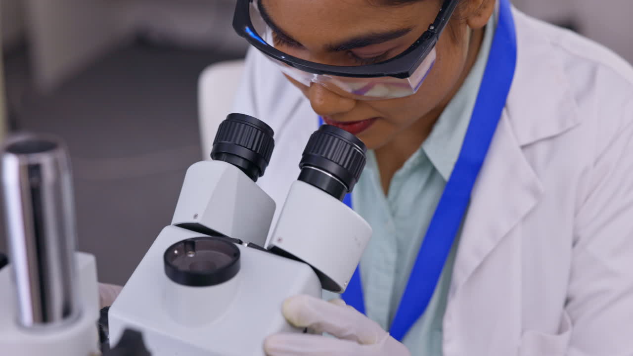 Medical science, woman and a microscope