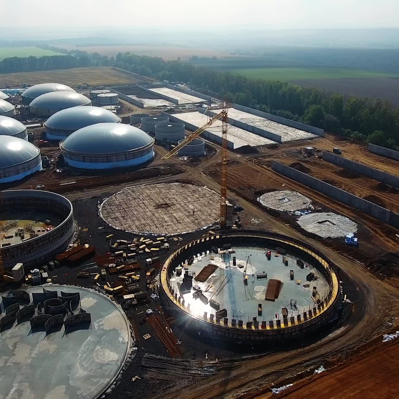 Station of bio gas production. Modern factory. Ecological production. Building plant in field