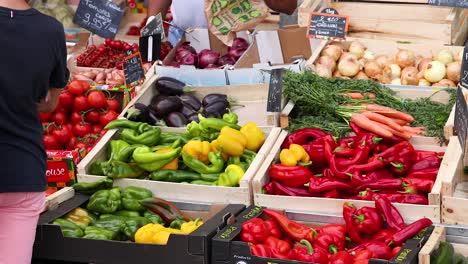 colorful produce displayed at a bustling market