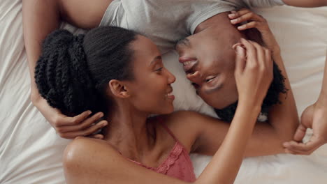 love, black couple and kiss on bed in bedroom home