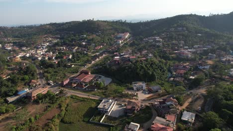 Aerial-view-of-Clouds-over-Cityscape-at-Madikeri,-Coorg,-Kodagu,-Karnataka,-India