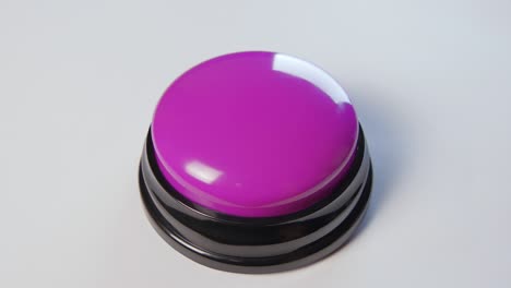 young woman pushing purple button with a finger and palm of her hand. press a round glossy button, top view. activation, launching something. turn on and off.