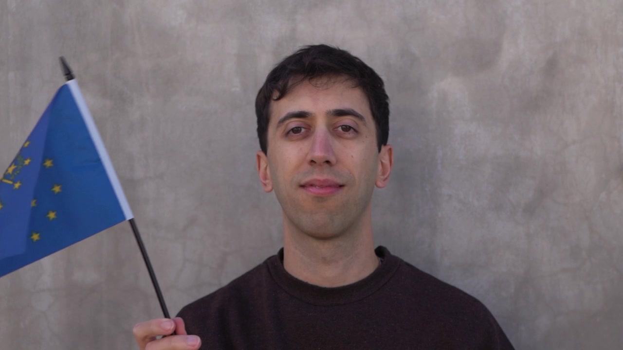 Slow motion shot of a man waving Indiana state flag. USA states concept. Close up.