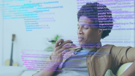 animation of data processing over african american businessman talking on smartphone