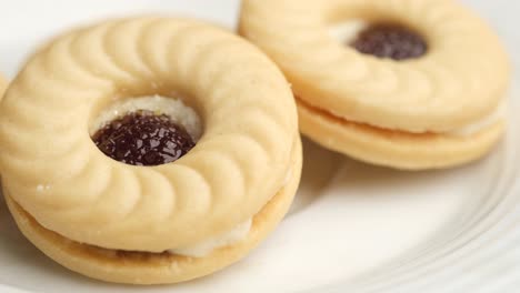 close-up of jam-filled sandwich cookies