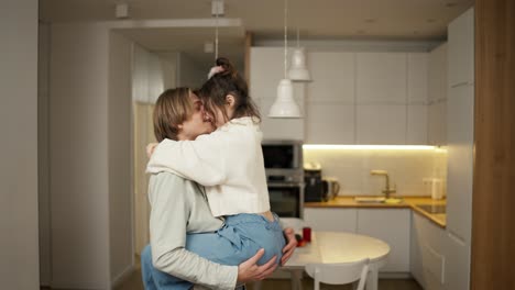 Romantic-evening---woman-jumps-to-his-boyfriend-hands-and-whirling-in-dance