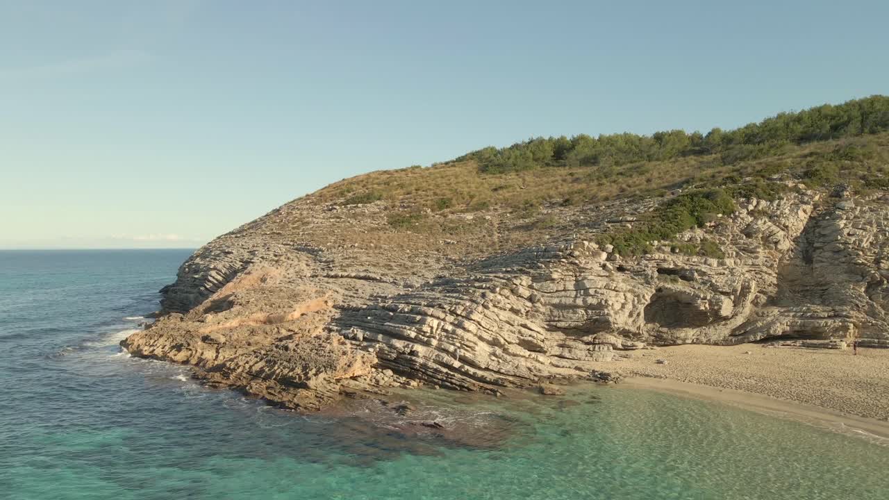 Experience the tranquility of Cala Torta in Mallorca, where turquoise waters meet rugged cliffs. The untouched beaches and natural beauty create a perfect escape in Majorca.