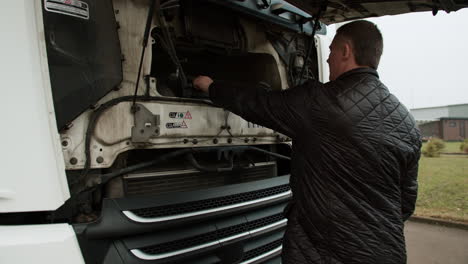 truck driver checking truck