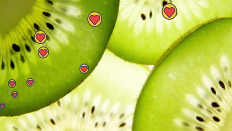 animación de iconos de corazón sobre la fruta del kiwi