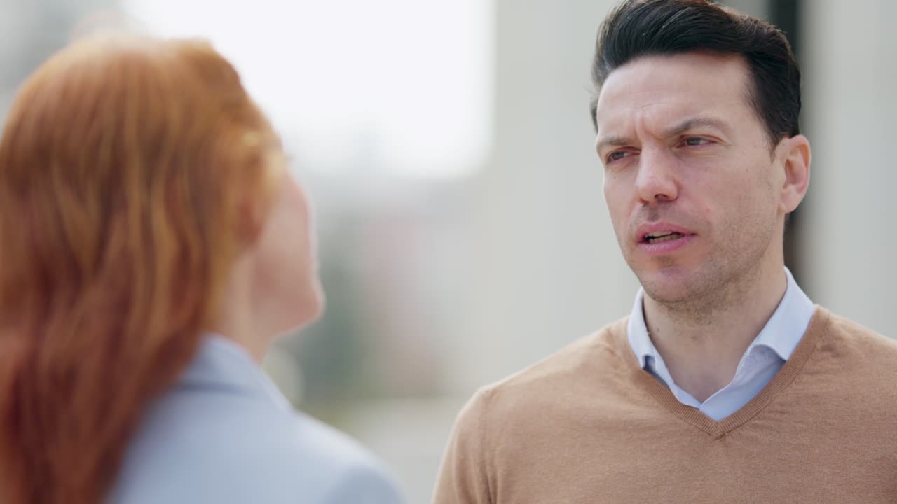 A man and woman having a conversation