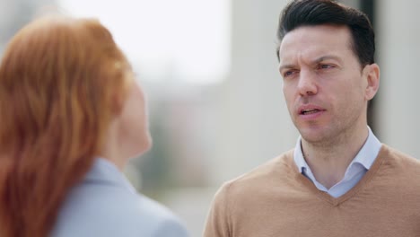 a man and woman having a conversation