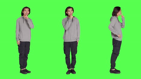 adult doing hush sign over greenscreen