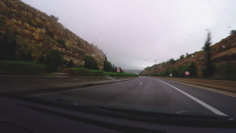 a car dashboard view, on national highway of greece(e1)