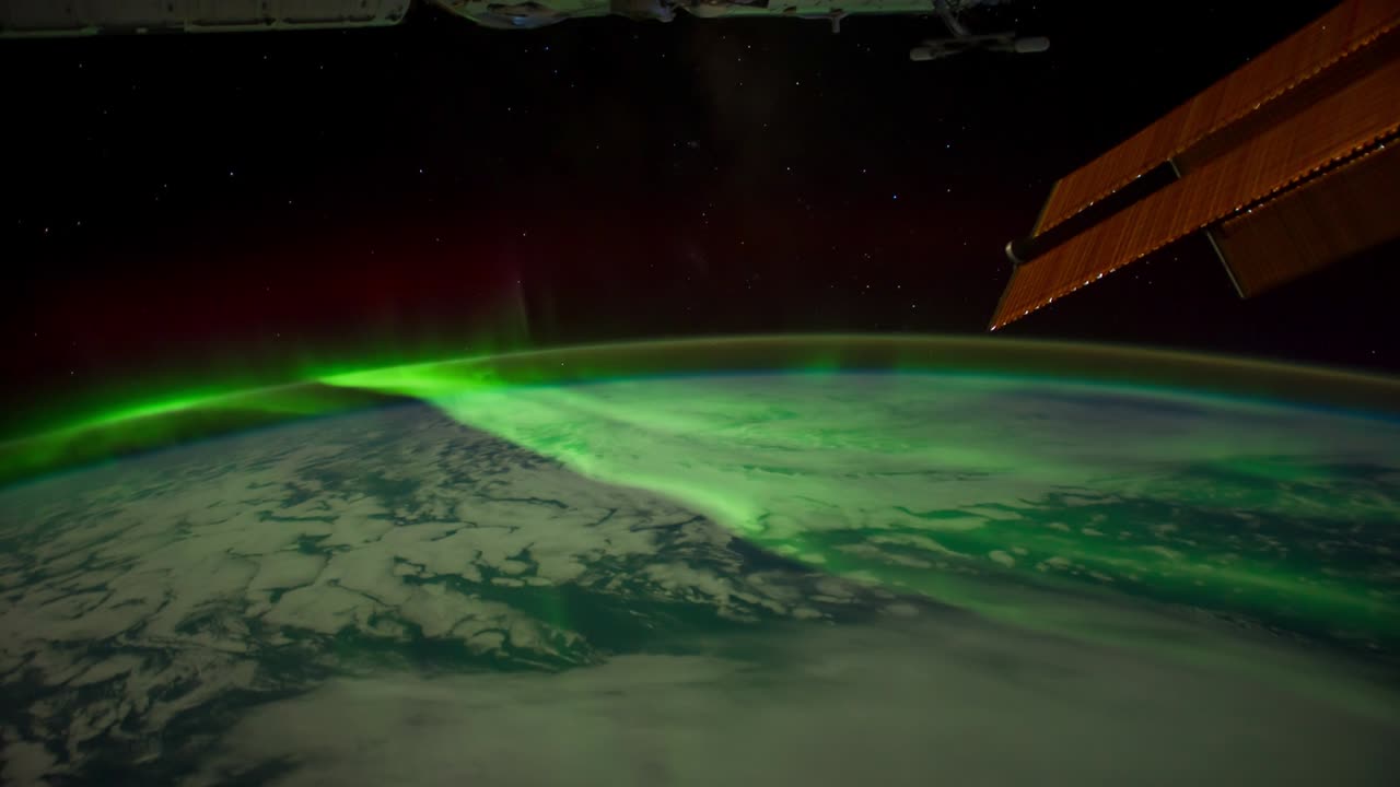 vista del planeta tierra con auroras y estrellas.