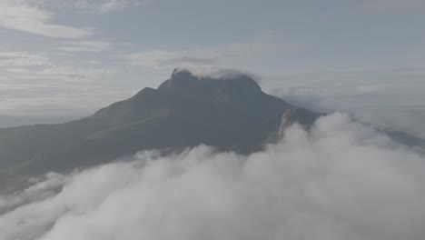 aerial drone view above clouds of mt. kasigau at sunrise