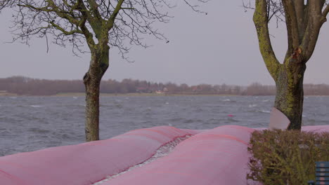 water tubes have been deployed to protect nearby properties from the flooding after a storm