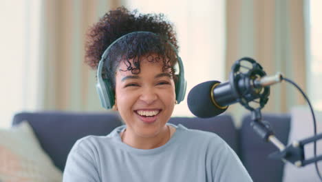 woman recording a podcast while wearing headphones