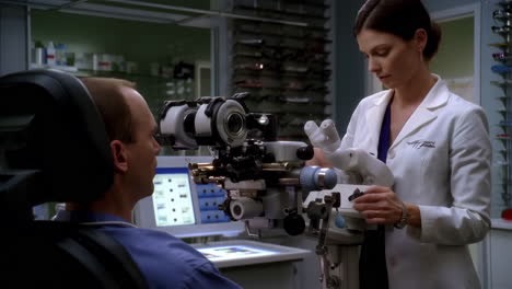 an optometrist performs an eye examination on a patient